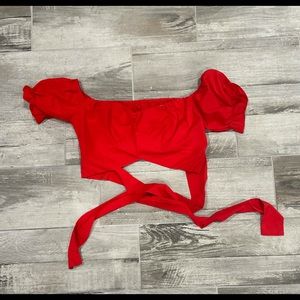 red, crop top blouse with a tie in the back (or could tie in the front)